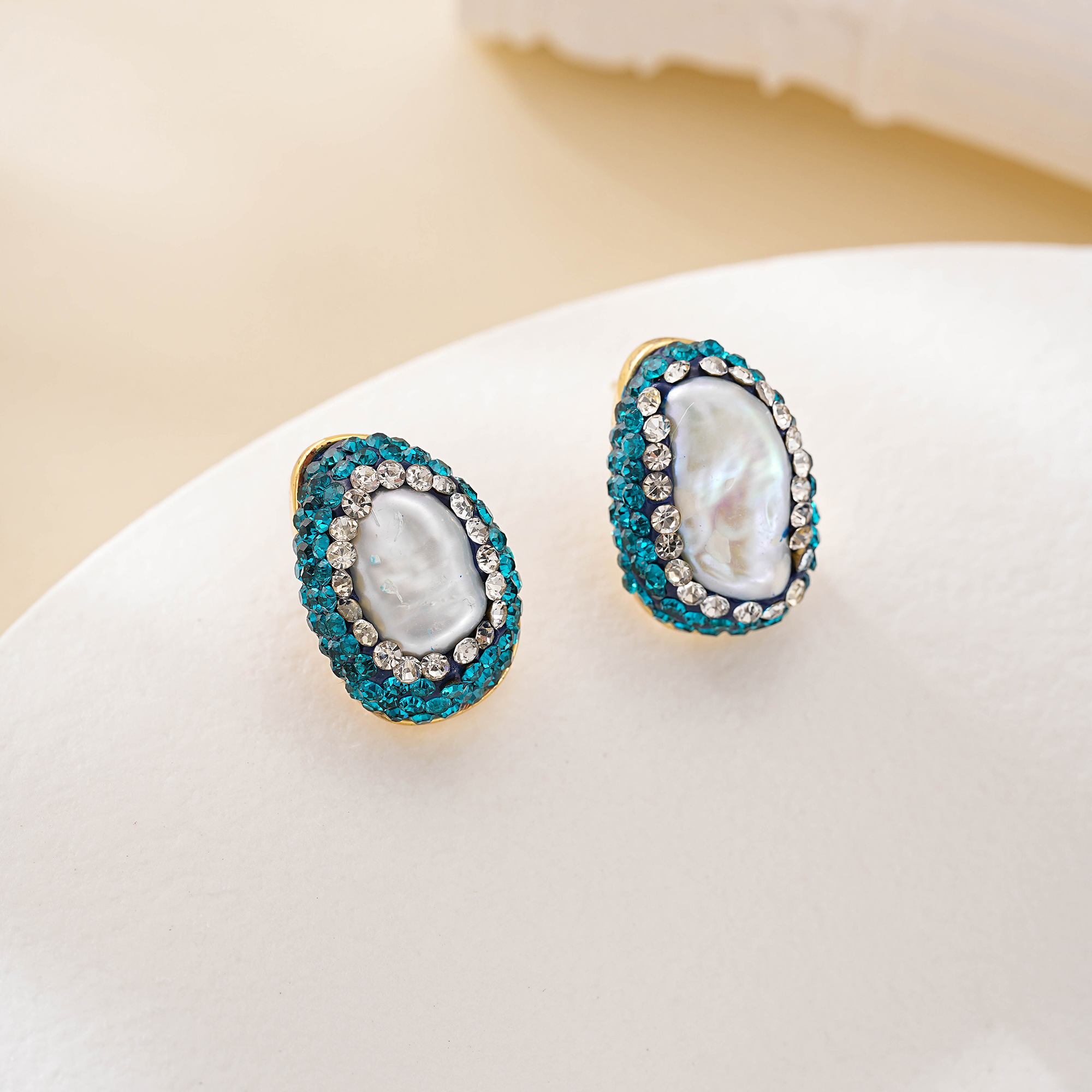 Pair of Art Deco-inspired pearl halo stud earrings