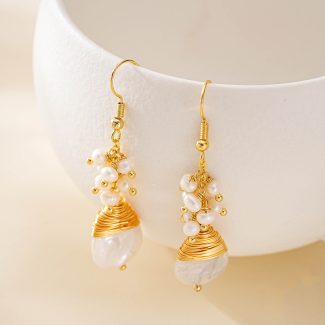 Small freshwater pearl clusters above teardrop baroque pearls