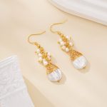 Pair of gold-tone hook earrings with wrapped baroque pearl drops