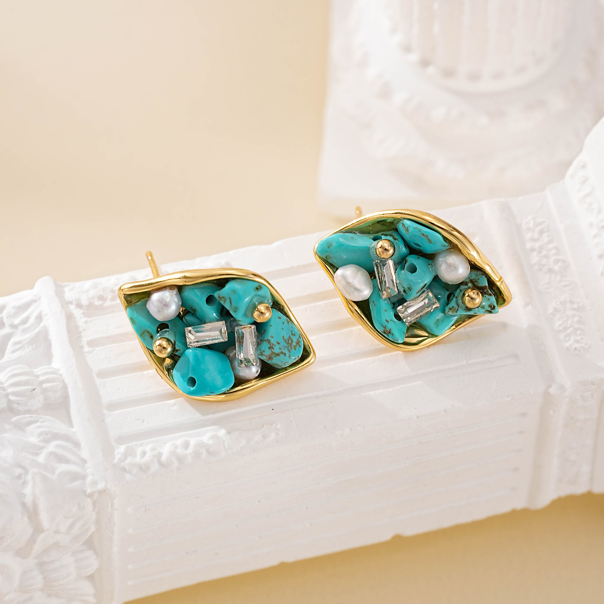 Turquoise chips and small pearls inside gold-tone leaf outlines
