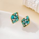 Close view of turquoise chip and freshwater pearl leaf design