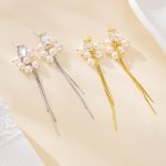 Pearl cluster tassel earrings shown in gold and silver finishes