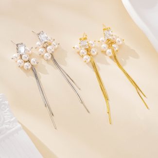 Pearl cluster tassel earrings shown in gold and silver finishes