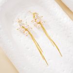 Pair of gold-finish pearl cluster tassel earrings