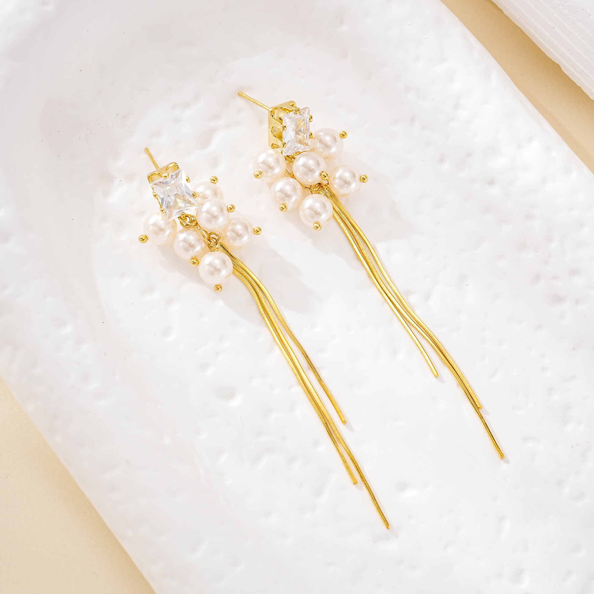Pair of gold-finish pearl cluster tassel earrings