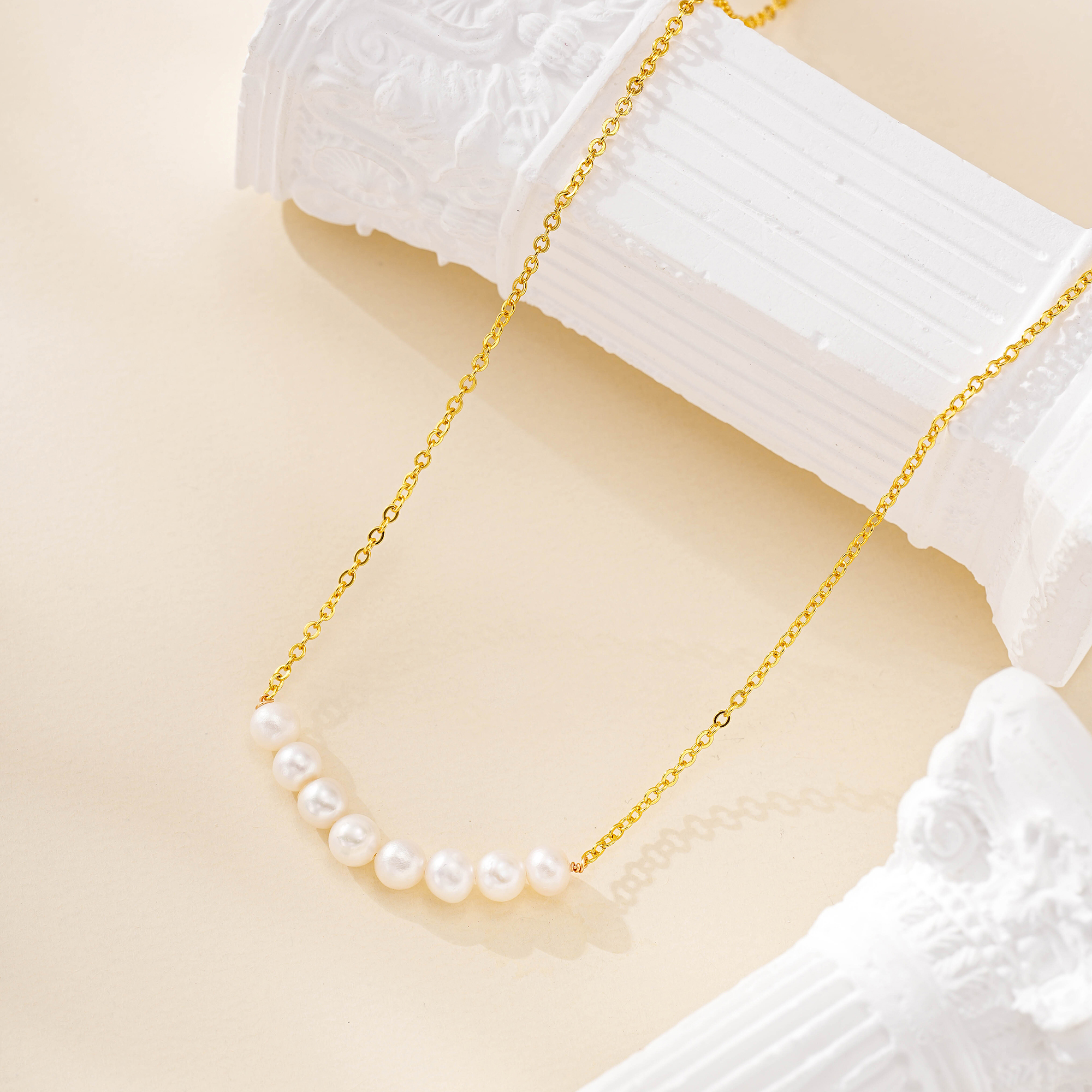 Eight-pearl necklace on a delicate gold-tone chain
