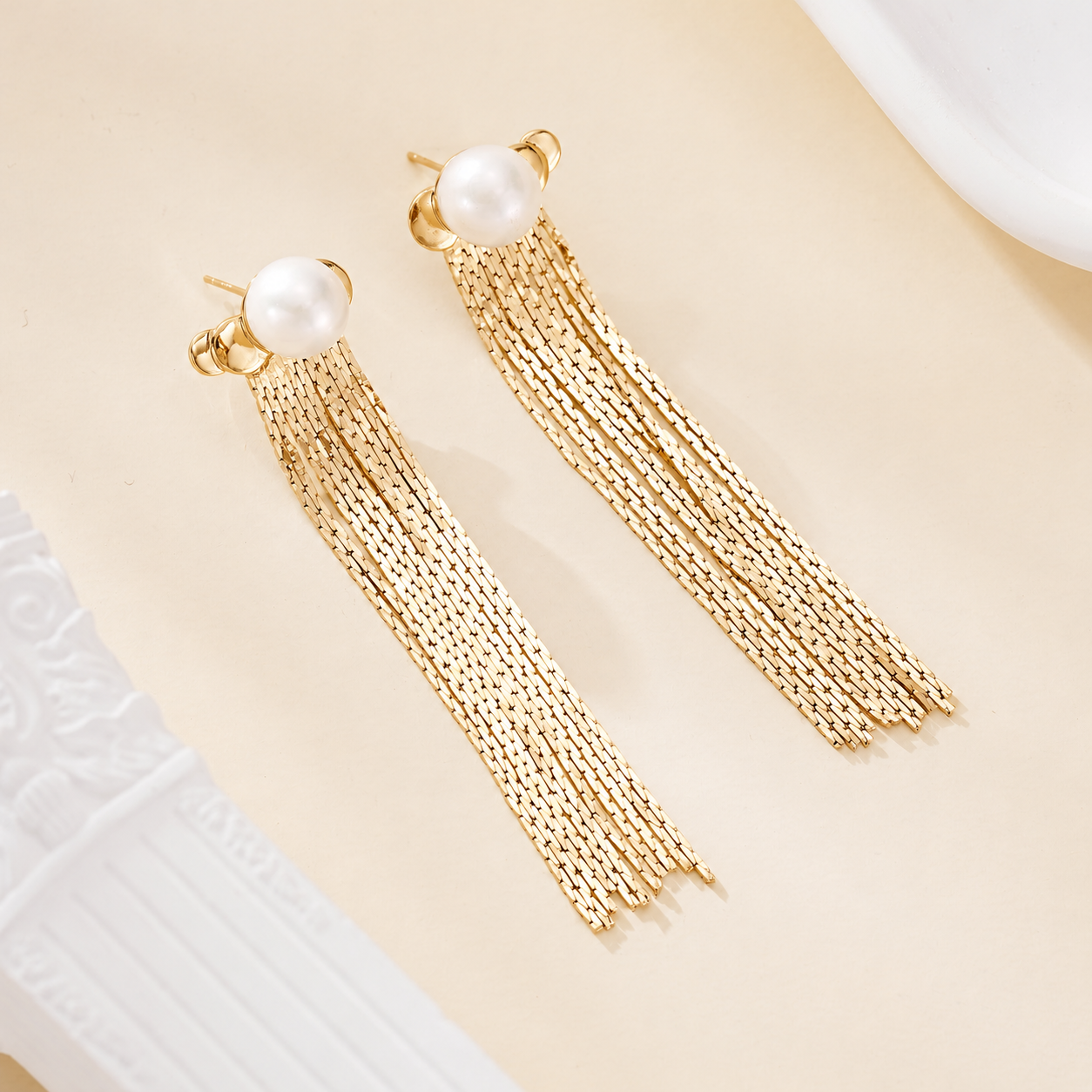 Gold-tone freshwater pearl stud earrings with long chain tassels