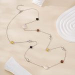 Full view of silver-tone baroque pearl and resin necklace