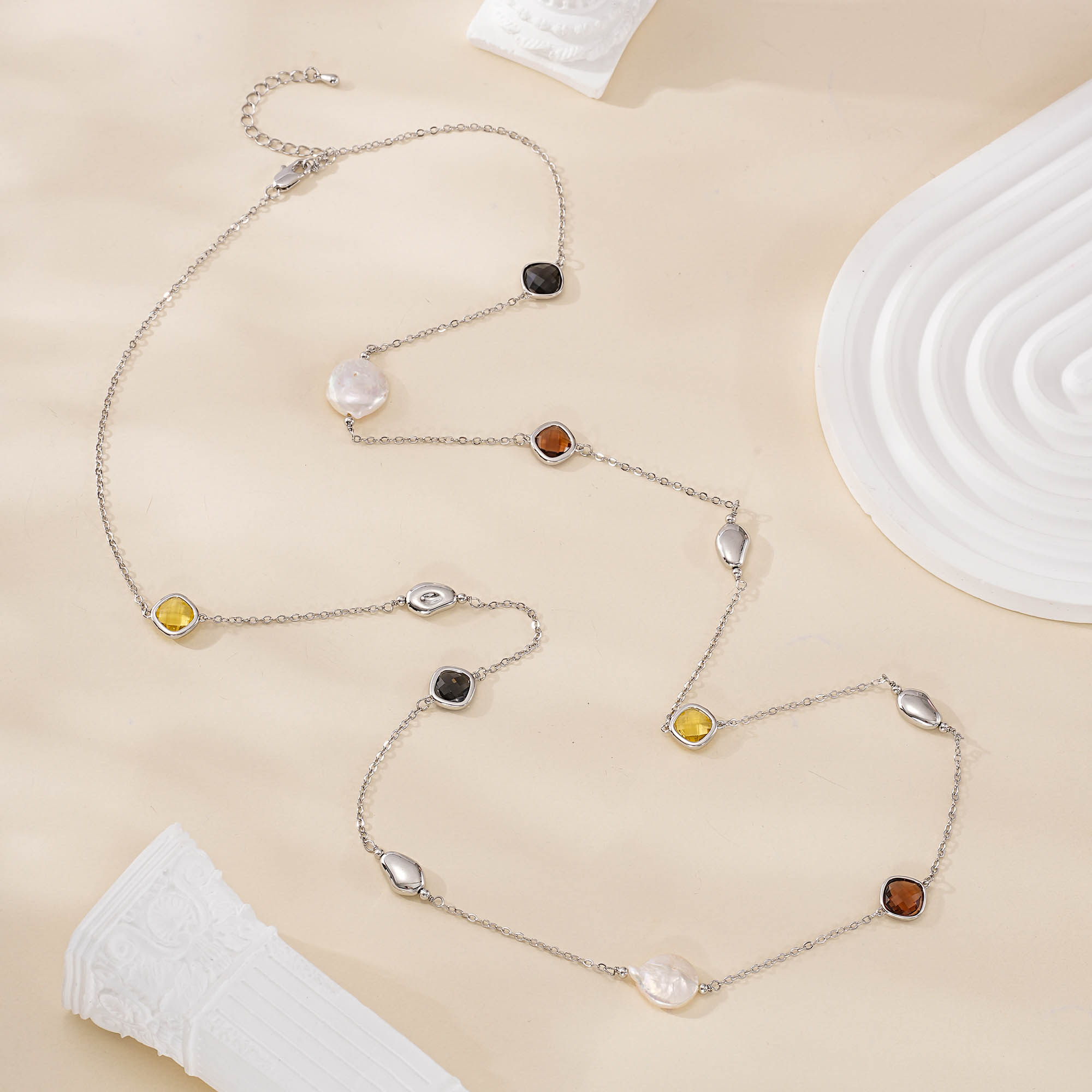 Full view of silver-tone baroque pearl and resin necklace