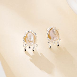 Silver-plated copper stud earrings with a baroque pearl in a molten metal setting